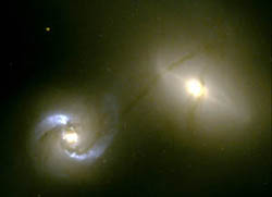 This image captured by the Hubble Space Telescope, during observation time awarded to Dr. William Keel, shows two galaxies colliding. 