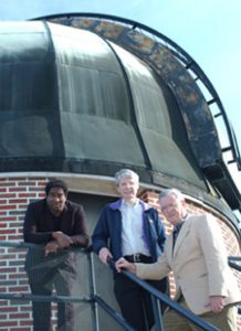 Tarsh Freeman (left) and Drs. Ron Buta (center) and Gene Byrd believe an oddity surrounding a galaxy may be a result of it having earlier consumed a smaller galaxy. 
