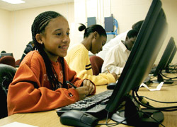 Eighth grade students Alesha Marsh, foreground, Camille Jones and Roderick Gray at Greensboro East High School. 
