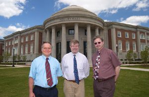 Dr. Anthony J. Arduengo, Saxon professor of Chemistry, Dr. David A. Dixon, Ramsay professor of chemistry, and Dr. Joseph Thrasher, professor and chemistry department chair, stand in front of Shelby Hall. 