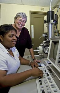 Samantha Webb, seated, a Stillman College student, and UA's Dr. Harriett Smith-Somerville, study the role of protozoa in the cycling of phosphate from phytate. Phytate is a potential contaminant in agricultural areas. (photo: Rickey Yanaura) 