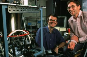 Physicists Carl Wieman (right) and partner Eric Cornell with the apparatus used to achieve the Bose-Einstein condensate, research that won them the Nobel Prize in 2001. Wieman will present a public lecture and meet with faculty and administrators at The University of Alabama Sept. 21-22. (Photo by Ken Abbott / University of Colorado at Boulder.) 