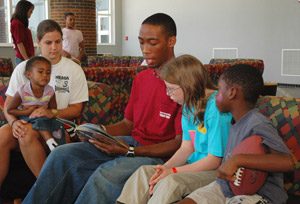 UA students read to children who are staying at the Student Recreation Center after evacuating their homes. 