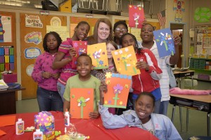UA student Katie McMurray with youngsters she mentors at Matthews Elementary School in Northport