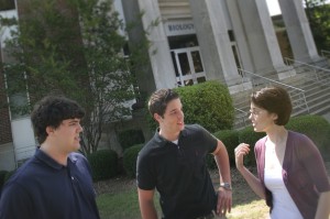 Max Thompson, far left, and Adam Knight talk with Stacey Fox earlier this month outside UA's Biology Building. (Photo by Zach Riggins, UA photography) 
