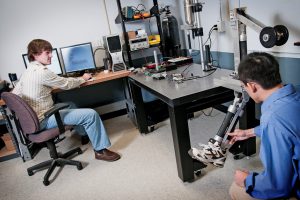 Graduate student Garrett Waycaster, seated, and Shen in UA's Bio-Robotics Lab. (Samantha Hernandez) 