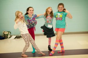 These Tuscaloosa Magnet School girls regularly work with Sarah M. Barry, assistant professor of theatre & dance, during a dance exploratory. 