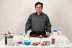 Lopez-Bautista with a few of the everyday items, such as salad dressing, dog food and ice cream, containing ingredients dervied from algae. 