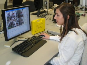 Lauren Wells, a senior in civil engineering, reviews data from the videos of seat belt usage.