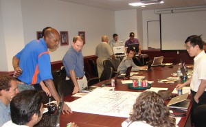 UA civil engineers work with the multi-institute research team reviewing the tornado path.