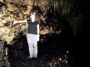 Hillary Sletten assisting with cave measurements at Ulupaka Cave. (Photo by Mellisa Douglas) 
