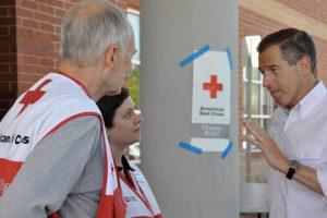 Horsley, middle, talks with NBC Nightly News Anchor Brian Williams about riding out the storm. (Danelle Schlegelmilch/American Red Cross) 