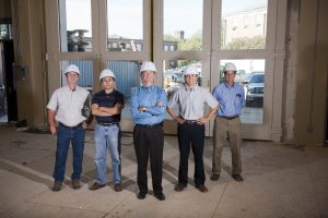 UA structural engineers stand atop a 32-inch concrete slab that weighs more than 1 million pounds. Standing on the future site of a shake table that will simulate earthquakes are, from left, Drs. Michael Triche, Jialai Wang, Ken Fridley, Andrew Graettinger and Jim Richardson (Jeff Hanson). 
