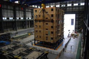 A seven-story test structure is moved onto the world's largest shake table in Miki City, Japan (John van de Lindt and Colorado State University). 