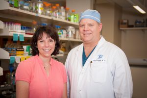 UA professor Carol Duffy, left, and Tuscaloosa surgeon William "Skip" Pridgen stand in Duffy's UA lab. 