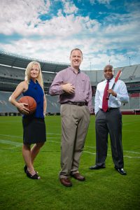Bissell, left, Billings, middle, and Brown stand inside Bryant-Denny Stadium. The trio is among UA's approximately 20 researchers with sports communication expertise. 