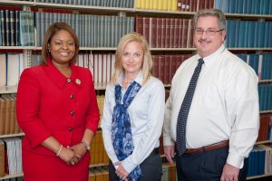 Standing, from left, are Felecia Jones, Dr. Kim Bissell and Dr. John C. Higginbotham. 
