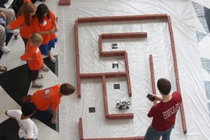 Participants in the 2012 Alabama Robotics Competition watch as their programmed robots perform inside Shelby Hall. 