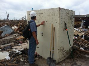 Dr. Andrew Graettinger, a University of Alabama researcher, examines a safe room that survived the tornado that struck Moore, Oklahoma, in May 2013. 