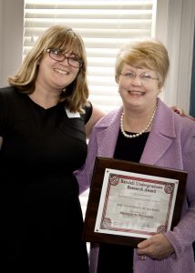Meredith Rickard of Atascadero, California, receives the Henry Pettus Randall Jr. Endowed Research Scholarship for her senior year at UA from UA President Judy Bonner. 