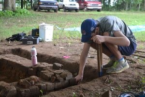 UA freshman Justin Toller excavates the chimney foundation during the Alabama Museum of Natural History's 36th Expedition. 