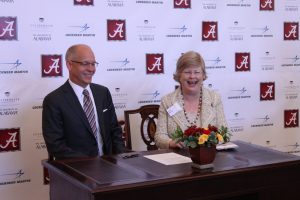 UA President Judy Bonner signs Lockheed Martin partnership with Dr. Ray O. Johnson, senior vice president of the company. 