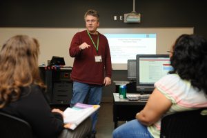 Dr. Jeff Gray, UA professor of computer science, will lead a national online course to help train teachers in a new computer science course. Above, Gray leads a training course for teachers from the Tuscaloosa area earlier this year. 
