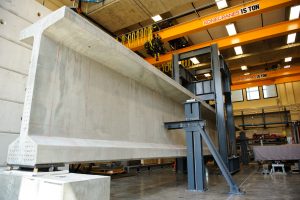Researchers with The University of Alabama College of Engineering are testing concrete girders in a campus laboratory to help lengthen bridge designs. 