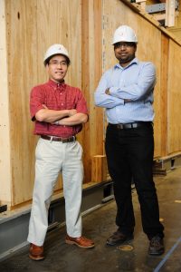 Dr. Thang Dao, left, and Dr. Sriram Aaleti, both assistant professors in civil, construction and environmental engineering, are developing a new method of constructing woodframed buildings. 