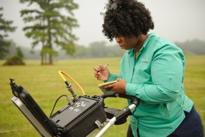 Lindsey Gordon records Ground Penetrating Radar data while surveying for underground features at Moundville Archaeological Park (Matthew Wood). 