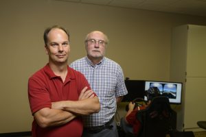 Dixon (left) and Houser stand in UA's VR and visualization lab (Jeff Hanson). 