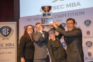 UA MBA students hold up the SEC MBA Case Champions Trophy in celebration. L-R: Katie Grayson, Matt Collins, Katie Lamberth, Abhinav Bhattacharya. 