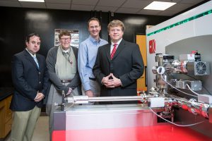 From left, Dr. Alberto Perez-Huerta, Dr. David Nikles, Dr. Greg Thompson and Rich Martens with the new CAMECA LEAP 5000 in the UA Central Analytical Facility. 