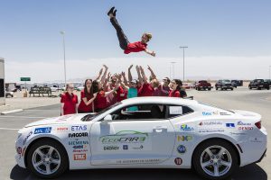 Members of the UA EcoCAR team having a little fun taking pictures with their Chevrolet Camaro while at the year-end competition. 