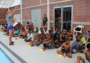 Students get basic safety instructions from a UA swim team teacher at the A.L. Freeman pool. 