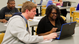 UA students teaching computer skills to the community