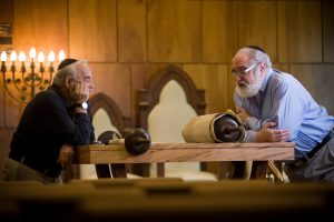 Dr. Paul Aharon (left) and Dr. Steven Jacobs with the Torah rescued from the Nazis in the Czech regions of Bohemia and Moravia. Radiocarbon dating proved it to be the second oldest complete Torah known.