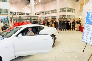 UA EcoCAR 3 team member Ryan Jones, a graduate student in mechanical engineering from Memphis, Tennessee, starts the 2016 Chevrolet Camaro after receiving the keys at Tuscaloosa Chevrolet (Jeff Hanson).