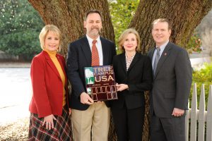 The Arbor Day Foundation recently honored The University of Alabama with the 2015 Tree Campus USA recognition for its commitment to effective urban forest management. From left are Donna McCray, UA director of grounds use permits and facilities operations; Jim Junkin, Alabama Forestry Commission; Dana Keith, UA associate vice president for financial affairs; and Duane Lamb, UA assistant vice president, facilities and grounds. 