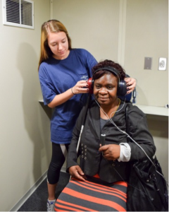 Student Taylor Branch conducts a hearing screening in the mobile clinic.