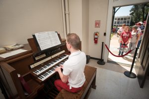 Tyler Canonica, a graduate student pursuing his doctorate in organ performance, plays the bell organ inside Denny Chimes on home football games