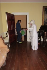 A ghostly Amelia Gayle Gorgas bids goodbye to a young visitor at last year's haunted museum tour. 