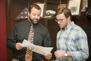 Tyler Hohbach, UA senior and Army veteran, discusses veterans benefits with Jason Sellars, former Army Ranger and assistant director of the UA Office for Veteran and Military Affairs. 