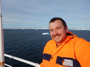 University of Alabama biologist Dr. Kevin Kocot on a boat near Antarctica.