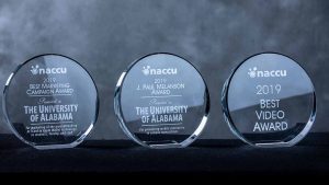 Three awards, glass with etched lettering to The University of Alabama Action Card Office