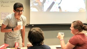 Young students in a classroom learn about writing at The University of Alabama.
