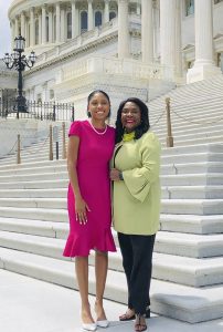 A student poses for a picture with a congresswoman in Washington, D.C.