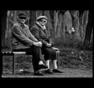 An elderly couple wearing sunglasses