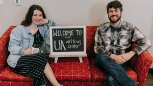 Two UA Writing Center tutors posed photo on couch