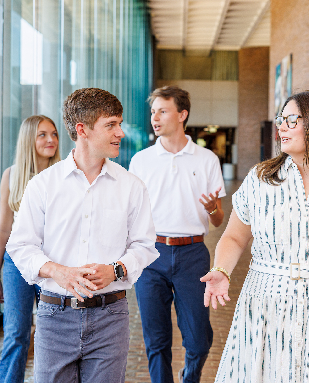 Students walking and talking in UA's School of Law